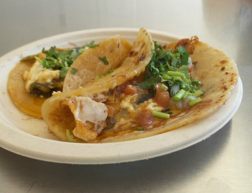 A paneer and poblano taco (front) and a paneer and poblano quesadilla at Trompo