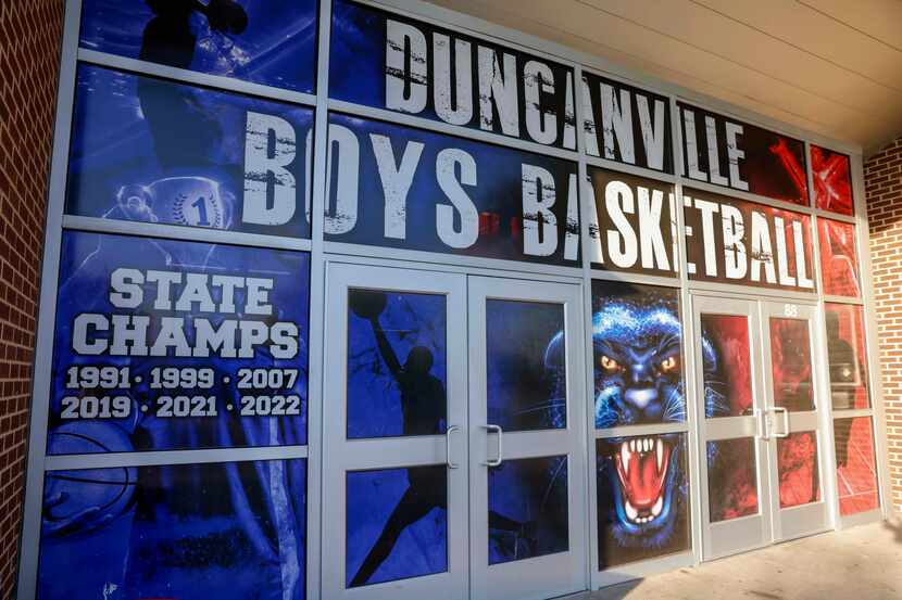 Window graphics list the basketball state championships won at Duncanville High School in...