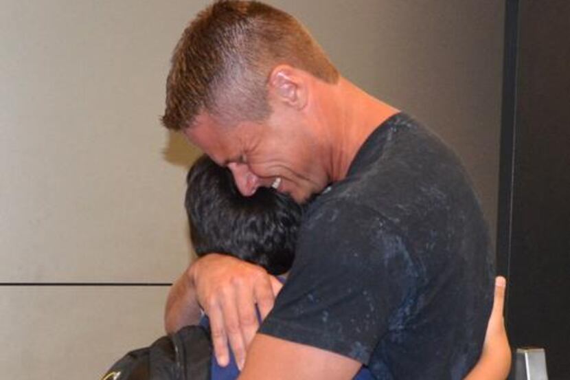 
Drew Drees, 10, and his father, Dean, were reunited late Wednesday at D/FW Airport after...