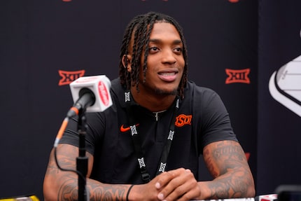 Oklahoma State running back Ollie Gordon II answers questions from the media during the Big...