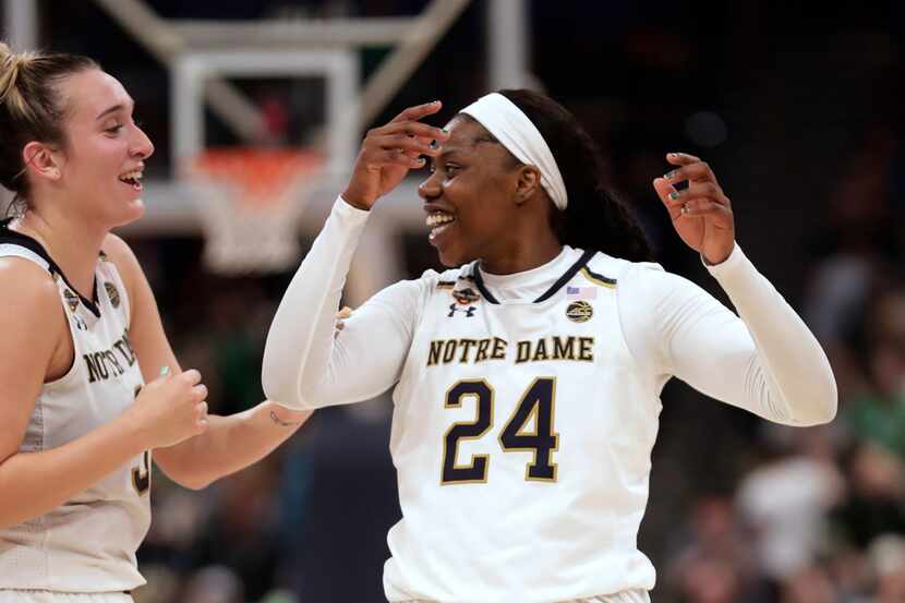 Notre Dame guard Arike Ogunbowale (24) and guard Marina Mabrey celebrate after Notre Dame...