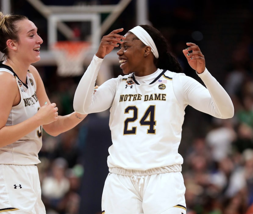 Notre Dame guard Arike Ogunbowale (24) and guard Marina Mabrey celebrate after Notre Dame...