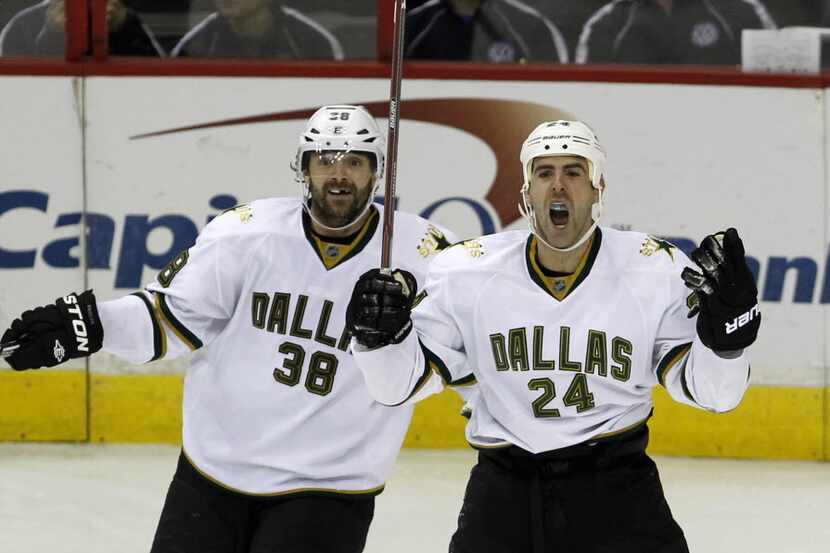 Dallas Stars left wing Eric Nystrom (24) and center Vernon Fiddler (38) react to a goal by...