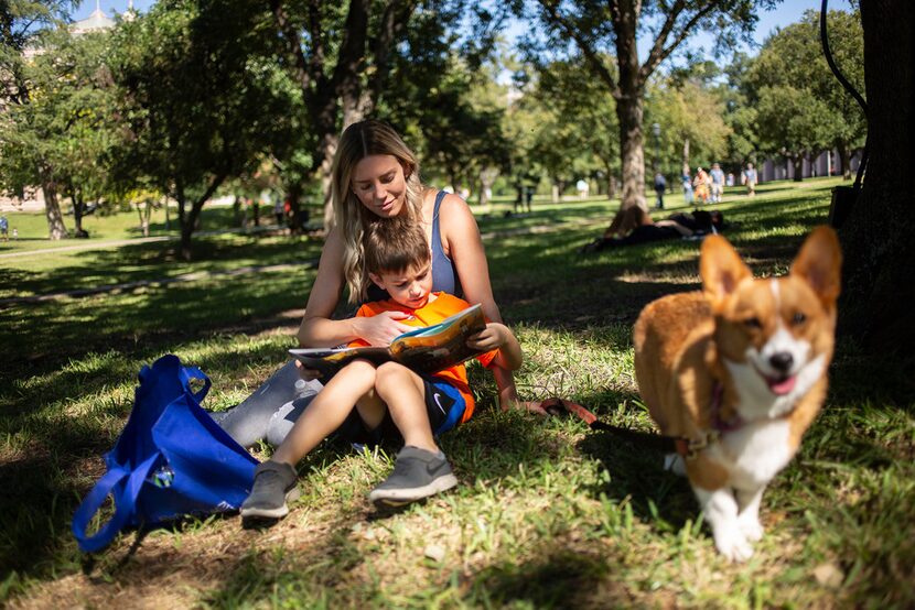 J.J. Wilhem, 6, reads The Adventures of Beekle: The Unimaginary Friend, by Dan Santat under...