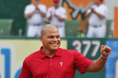 Ivan "Pudge" Rodriguez is all smiles as he emerges from the Rangers bullpen during...