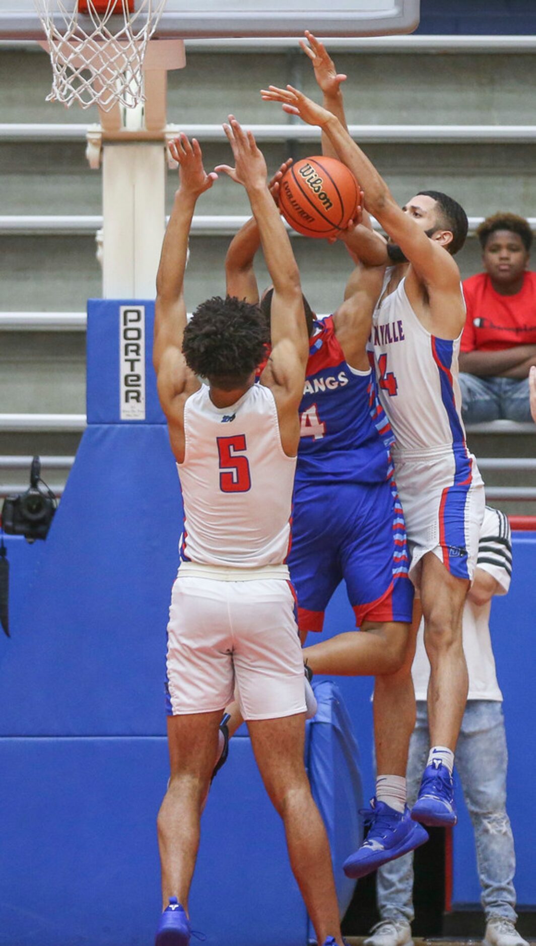 J. J. Pearce Chozen Amadi (4) shoots as he is defended by Duncanville guard Micah Peavy (5)...