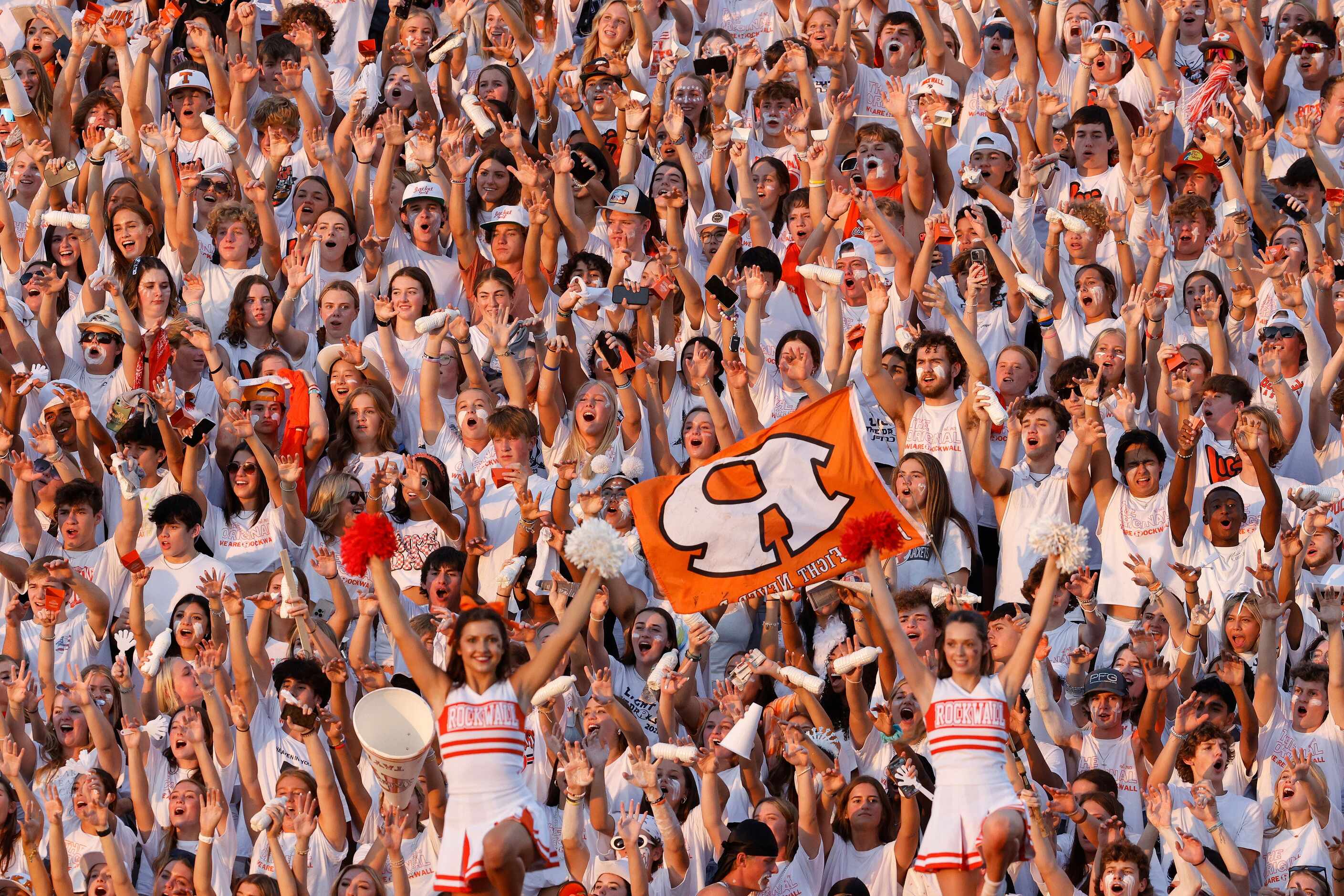 Rockwall fans cheer before the first half of a high school football game against...