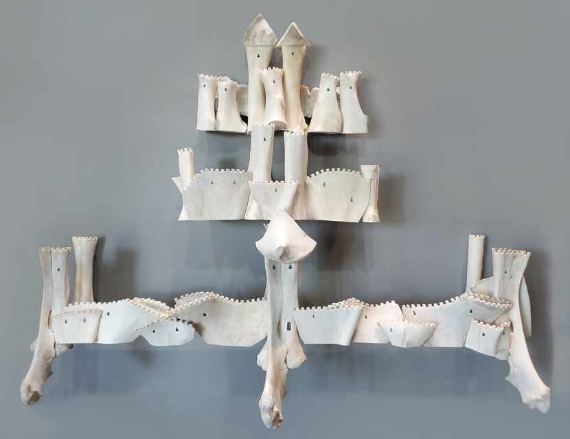"Promise," the final piece in the exhibition, is an ethereal castle made entirely of bones —...