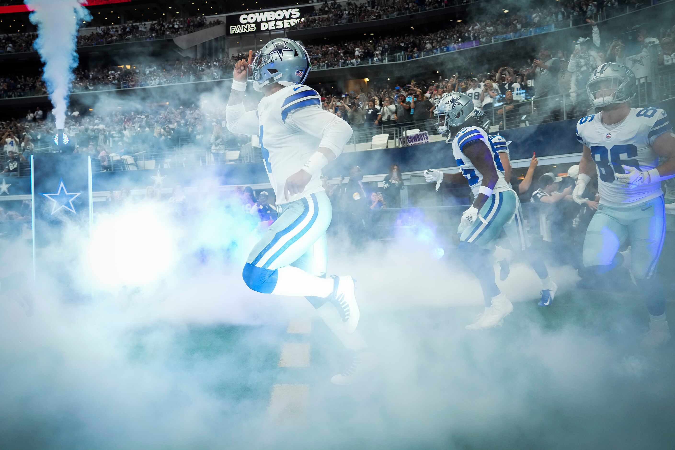 Dallas Cowboys quarterback Dak Prescott takes the field before an NFL football game against...