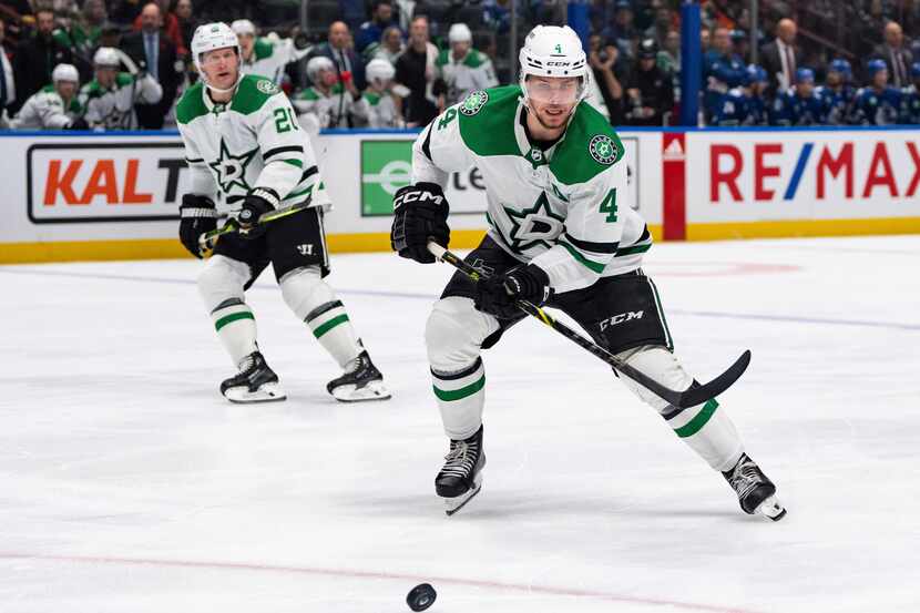 Dallas Stars' Miro Heiskanen (4) skates to the puck during the third period of the team's...