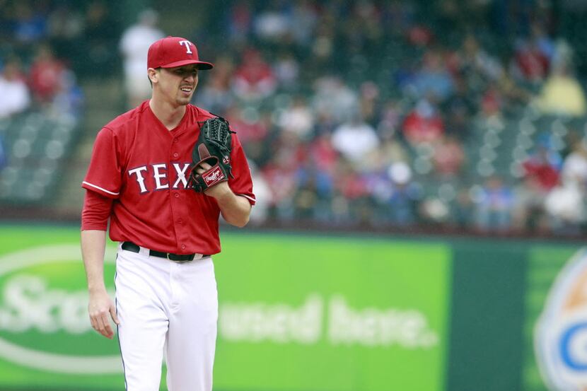 Apr 17, 2014; Arlington, TX, USA; Texas Rangers starting pitcher Tanner Scheppers (52) on...