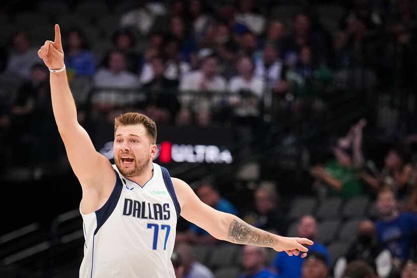 Dallas Mavericks guard Luka Doncic (77) reacts after a basket during the first half of an...