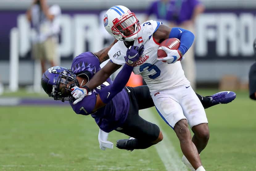 FORT WORTH, TEXAS - SEPTEMBER 21: James Proche #3 of the Southern Methodist Mustangs carries...