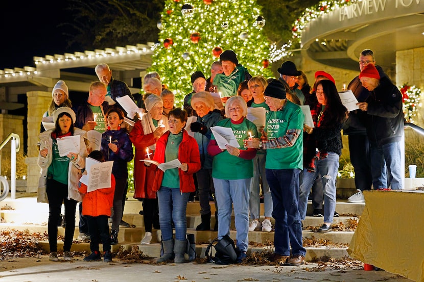 Attendees sing Christmas songs as part of the Legal Defense Fund Choir in front of Fairview...