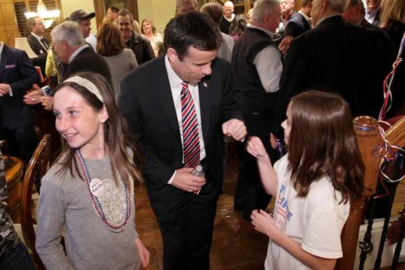 
John Ratcliffe gave a fist bump Tuesday night to 11-year-old daughter Darby at the...