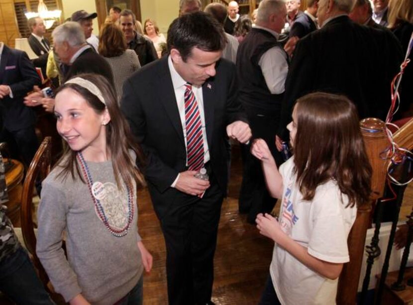 
John Ratcliffe gave a fist bump Tuesday night to 11-year-old daughter Darby at the...