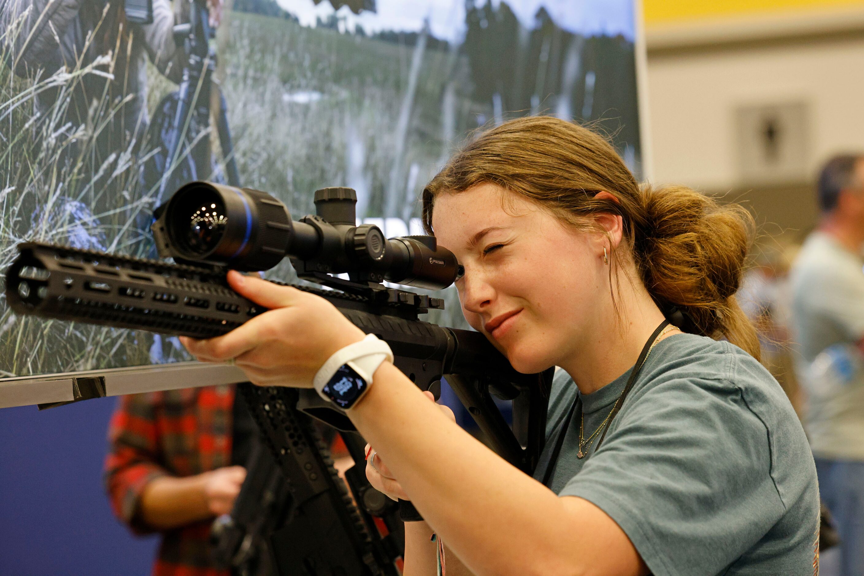 Megan Moates, 14, of Melissa, Texas, looks through a Pulsar Thermion 2 XQ50 Pro thermal...