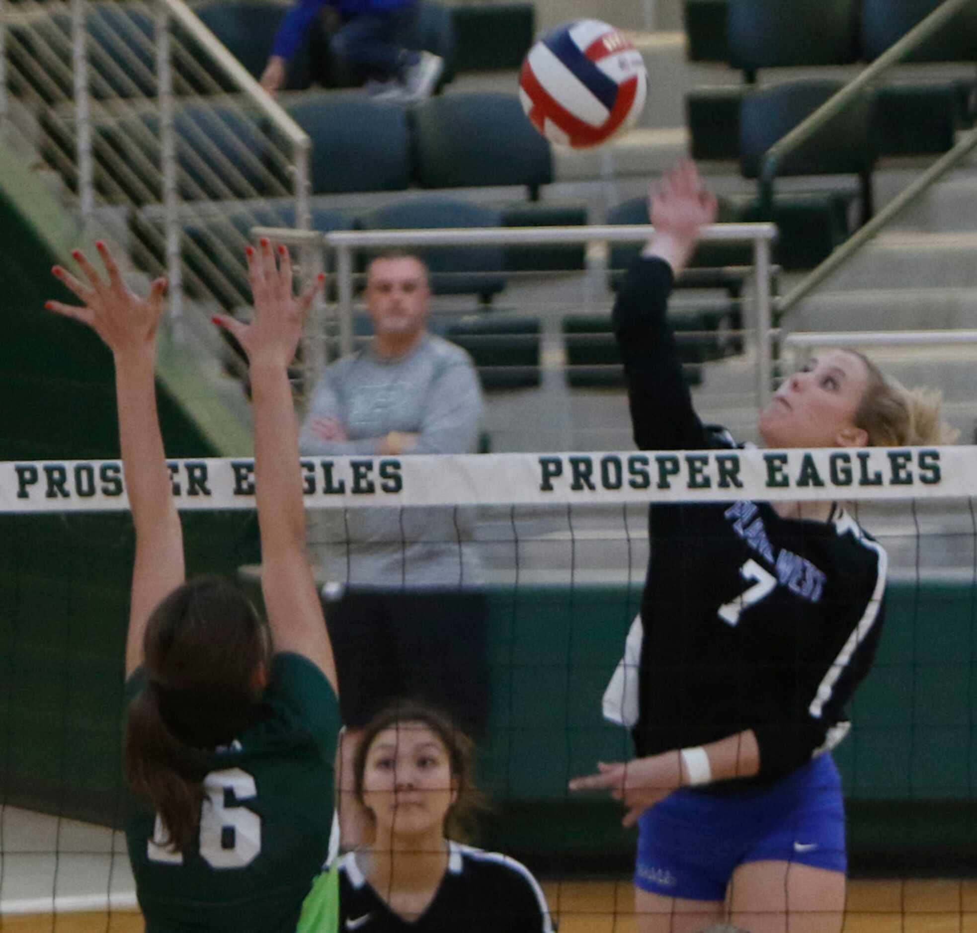 Jill Pressly (7), of Plano West, spikes against the defense of Prosper's Taylor Youtsey (16)...