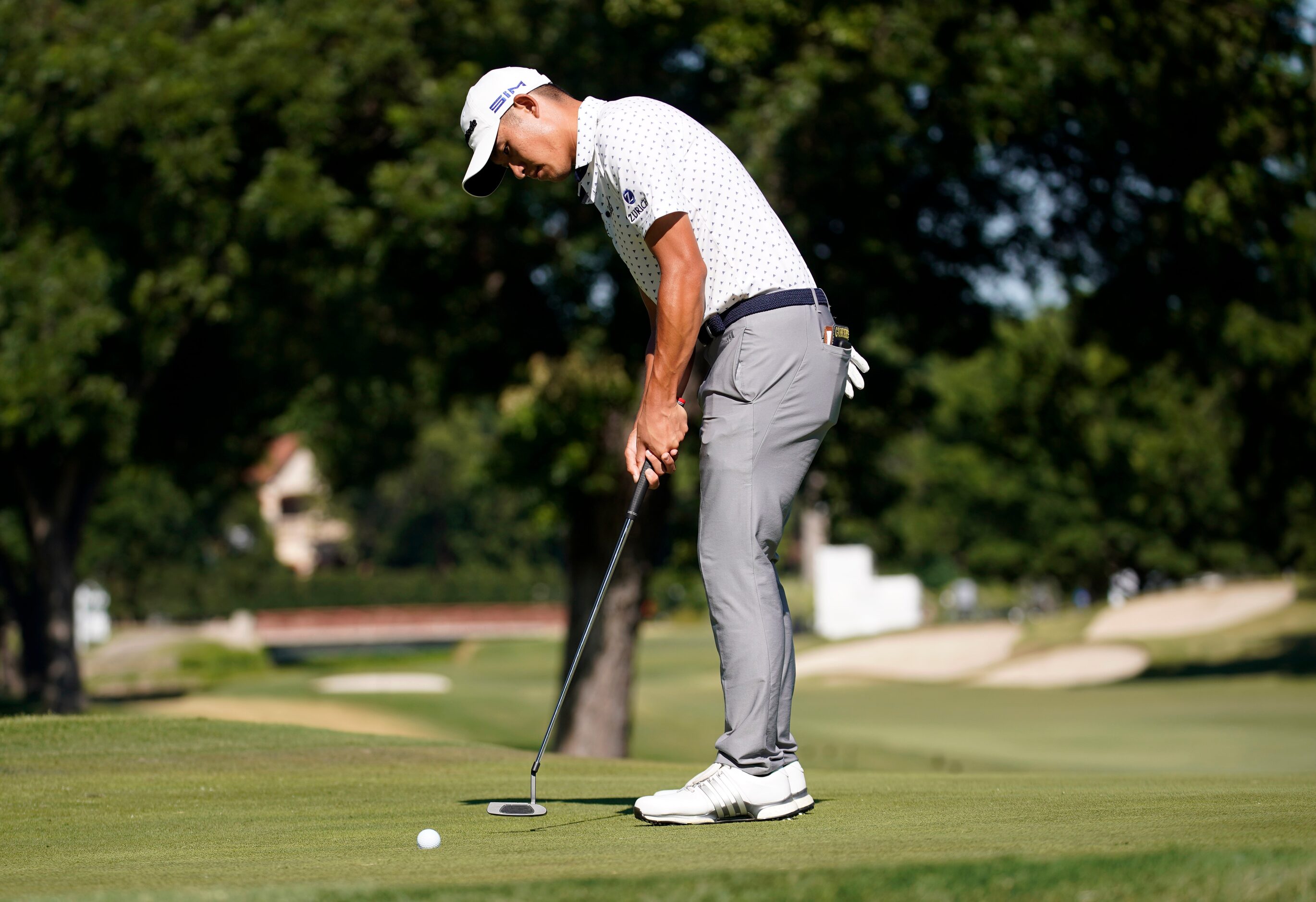 PGA Tour golfer Collin Morikawa watches his ball lip out of the hole, losing to Daniel...