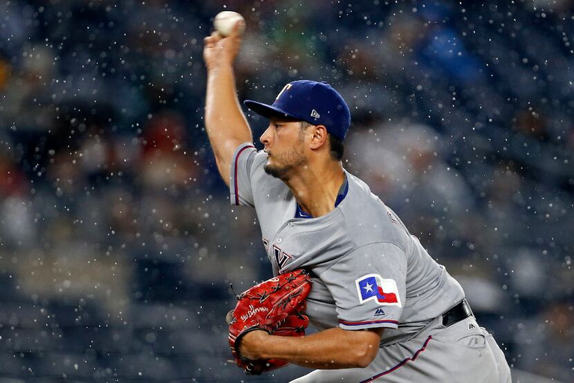 NEW YORK, NY - JUNE 23: Yu Darvish #11 of the Texas Rangers pitches against the New York...