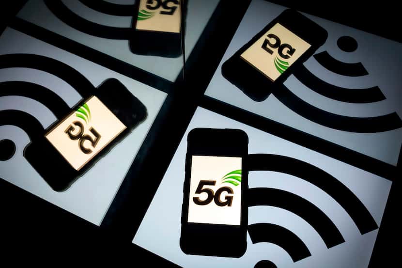 In this file photo illustration taken in 2019, a 5 G wireless technology logo is displayed...