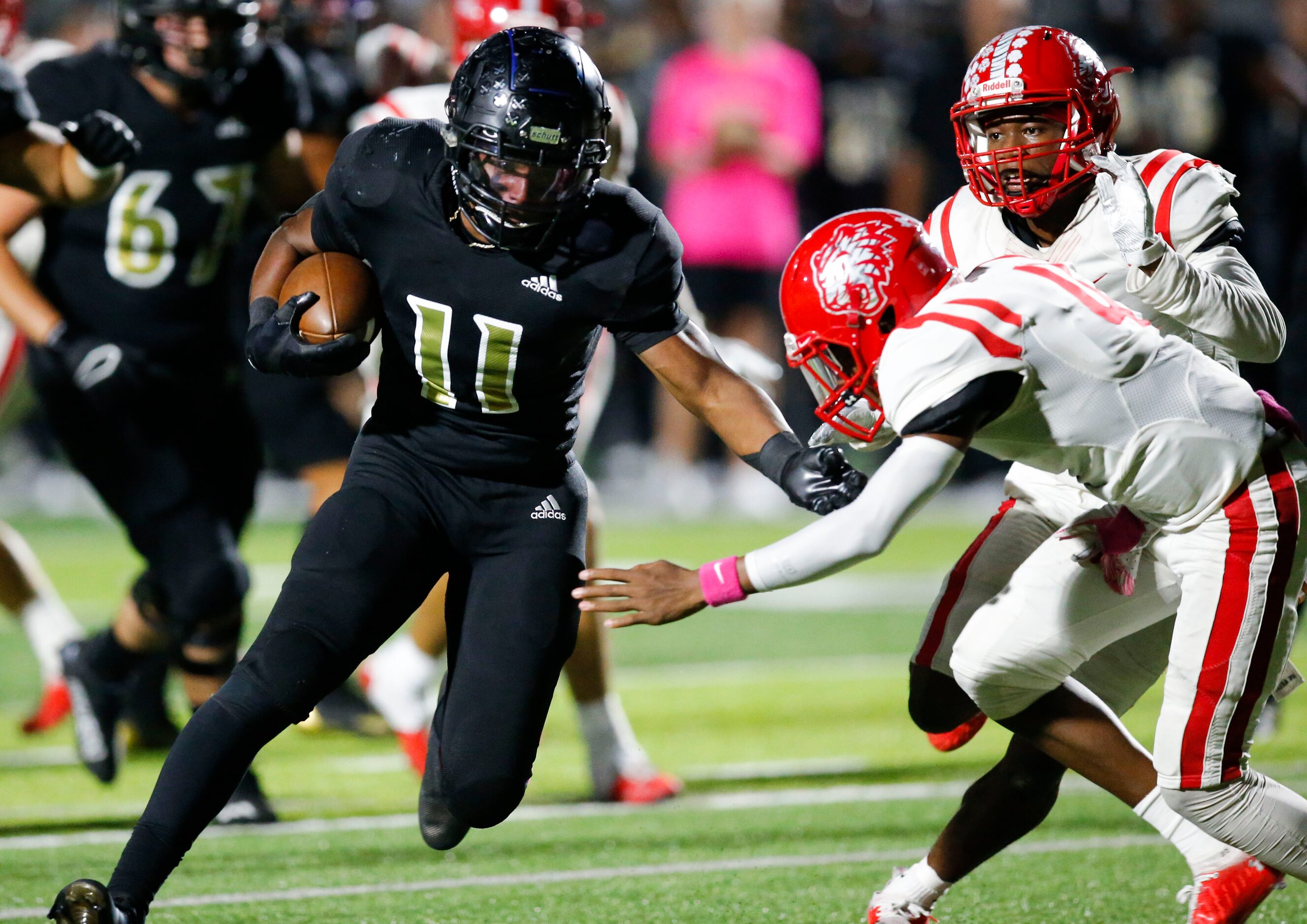 Kaufman junior running back Braxton Garmon (11) looks for room against Terrell sophomore...