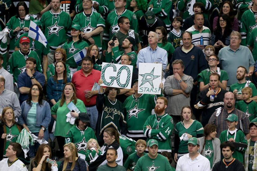  Dallas Stars fans cheer a 4-2 win against the Anaheim Ducks in the third period of Game...