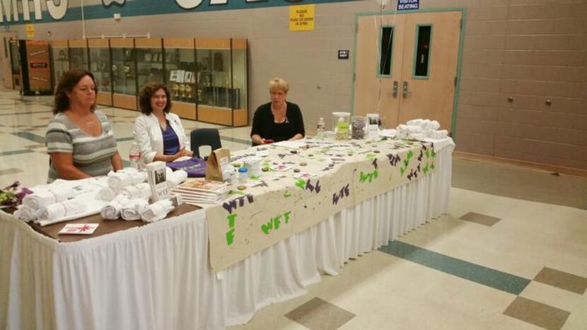 
Volunteers accept donations at the premiere of the new documentary “Not Me” at Flower Mound...