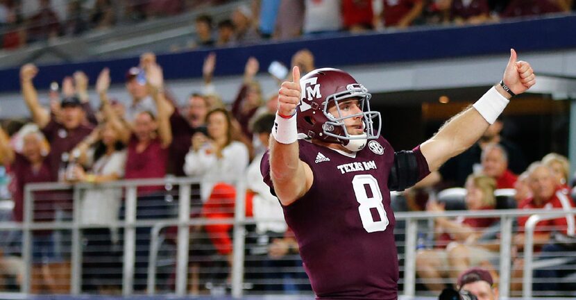 Texas A&M Aggies quarterback Trevor Knight (8) celebrates his long touchdown run against the...