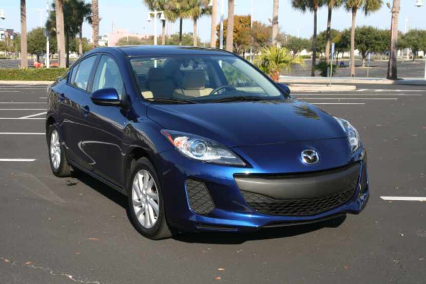 The Mazda3's grille, depending on your perspective, is somewhere between a grin and a leer,...