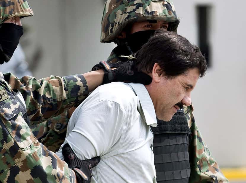Mexican marines present drug lord Joaquin "el Chapo" Guzman to the press on February 22,...