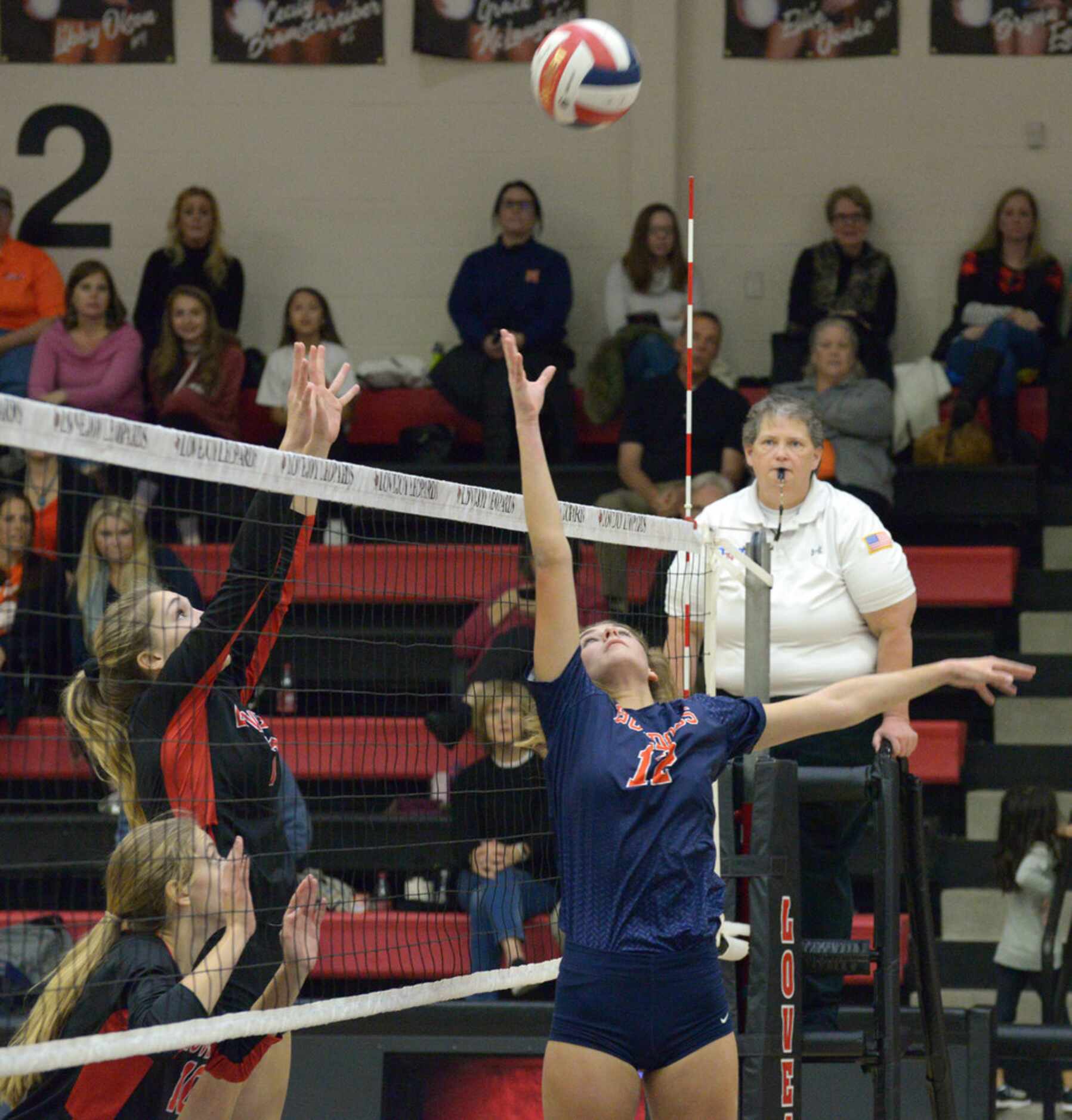 Lovejoy's Ellie Jonke, left, and McKinney's North's Lily Nicholson (12) watches as the ball...