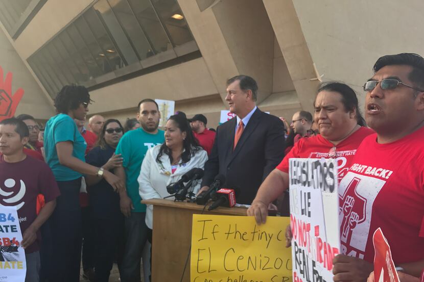 Dallas Mayor Mike Rawlings with protesters Wednesday morning outside Dallas City Hall. The...