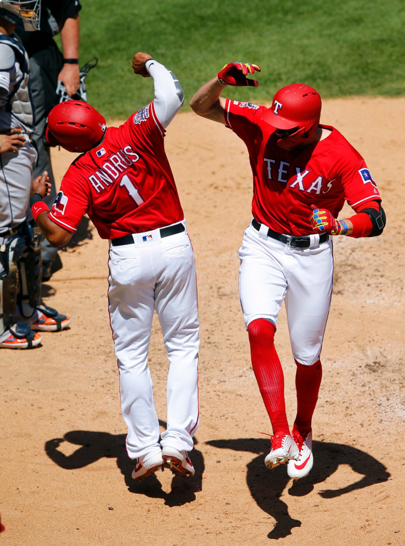 Texas Rangers right fielder Hunter Pence (right) is congratulated by teammate Elvis Andrus...