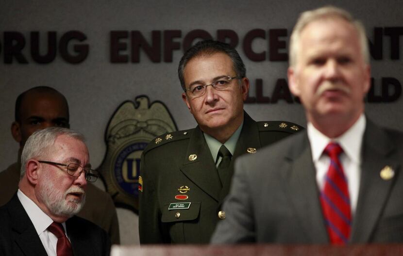
Gen. Oscar Naranjo, Colombia’s national police chief at the time, listened as John M....