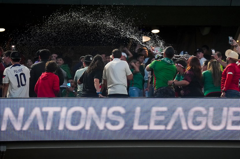 Beer is thrown in the stands during a pause in play due to Mexico fans’ homophobic chants...