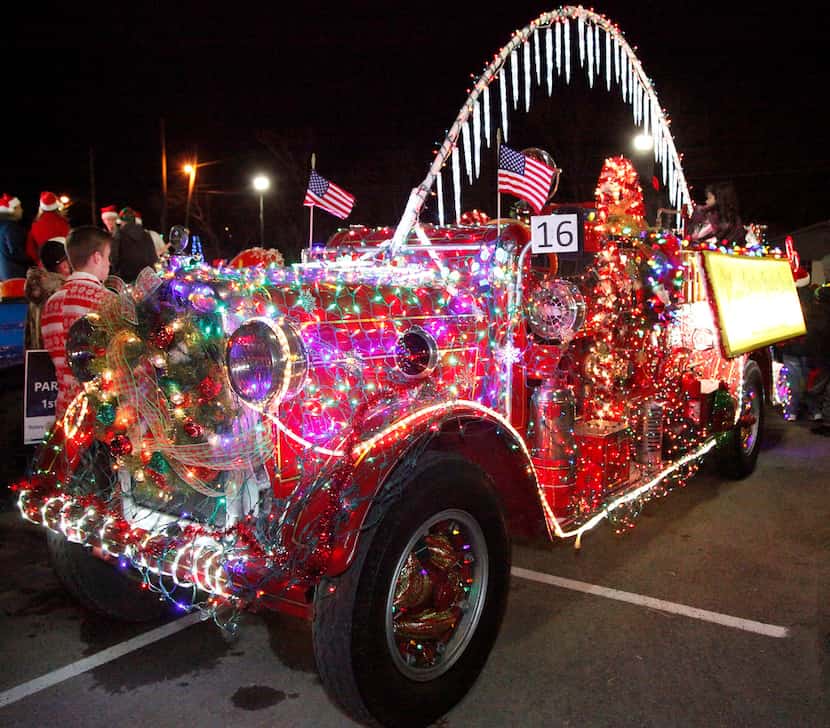 A decorated antique fire engine is ready to roll in the 2018 McKinney Christmas Parade of...