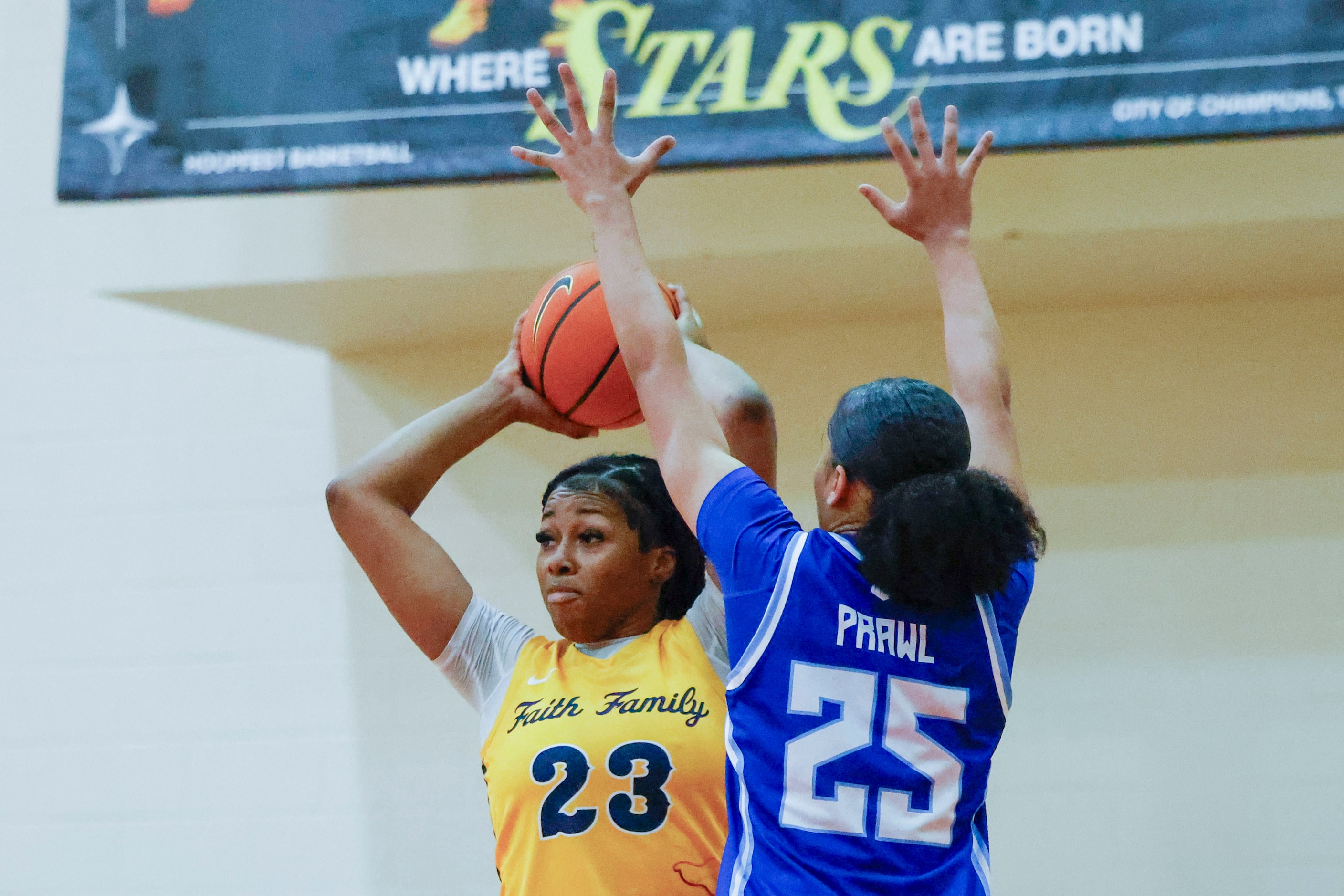 Oak Cliff Faith Family Academy’s Joy Egbuna (23) looks to pass the ball past IMG Academy’s...