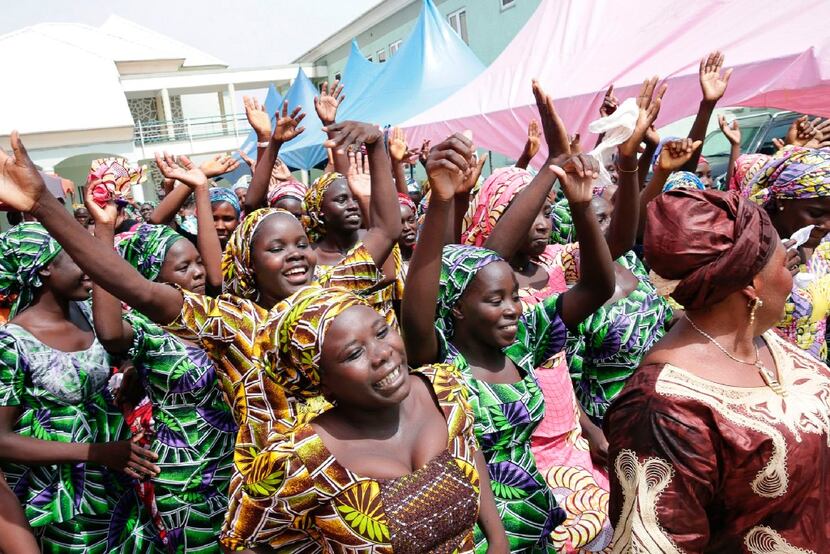 Shows some of the released Chibok girls celebrating before being reunited with their...