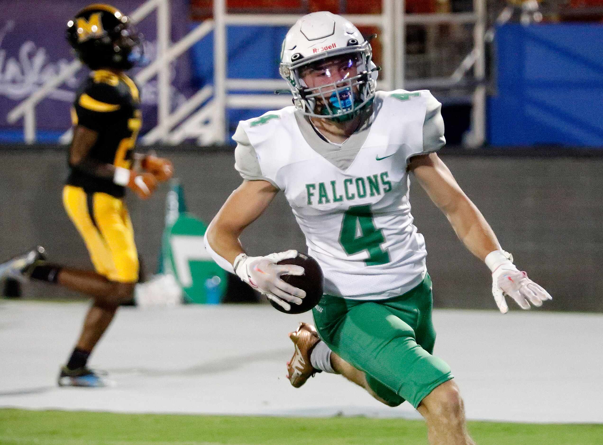 Lake Dallas High School running back Dylan Brauchle (4) takes a pass into the end zone...