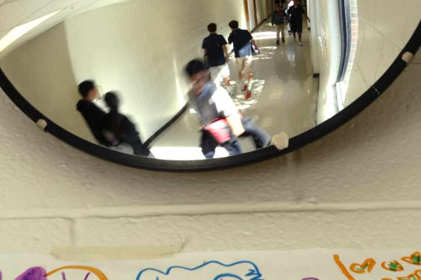  Students pass through the halls at a Dallas middle school. (Nathan Hunsinger/ The Dallas...