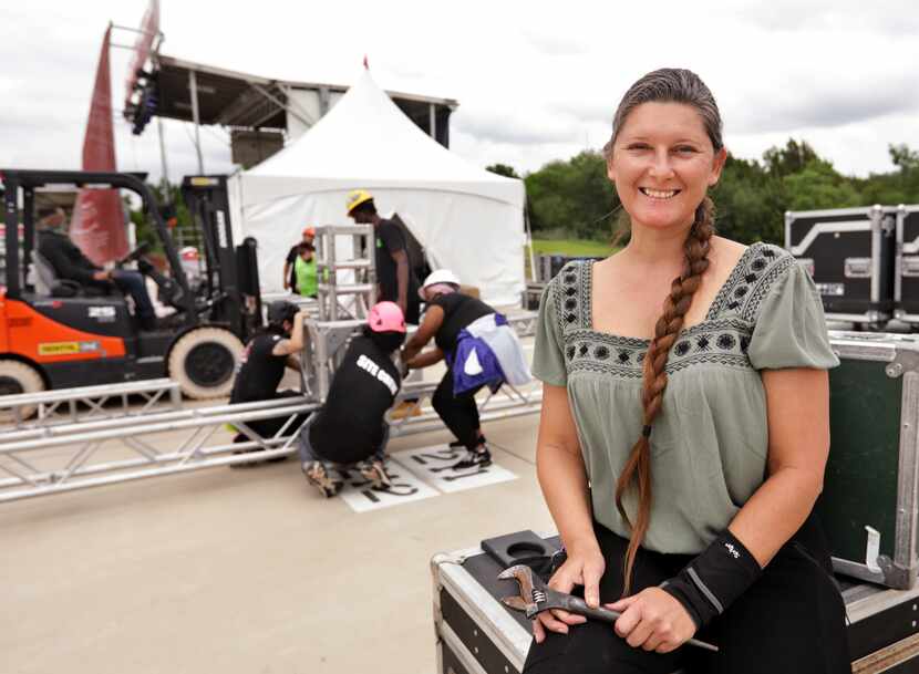 Hyacinth Belcher, right, oversees her employees as they set up a stage for an event at Crest...