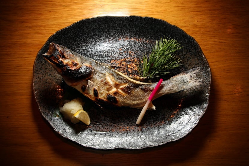 Branzino cooked over binchotan on the robata grill  at Tei Tei Robata Bar. 