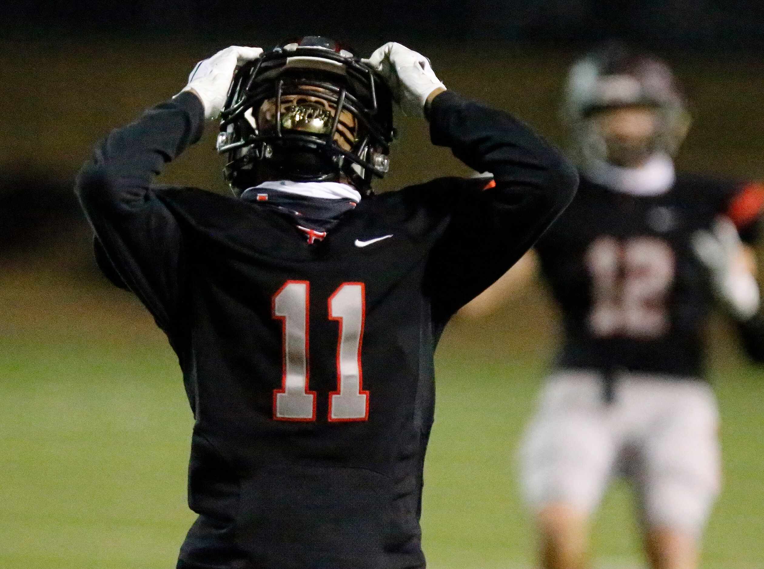 Lake Highlands High School defensive back Shamar Donaldson (11) reacts to dropping a pick...