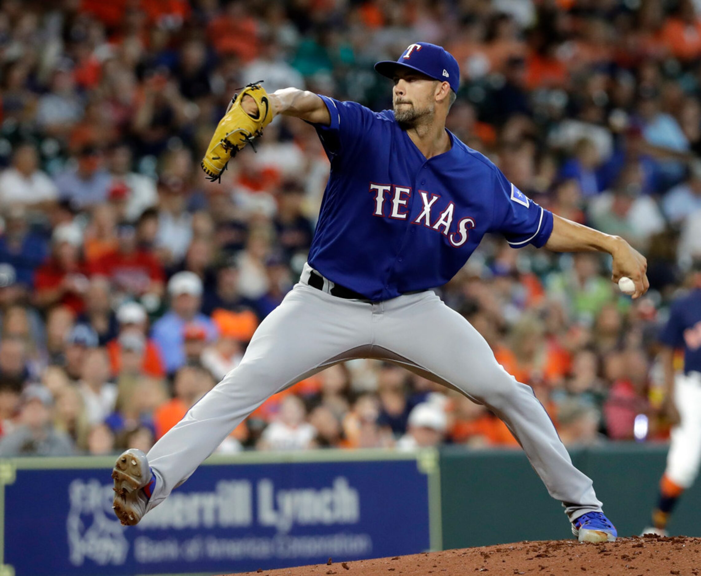 Texas Rangers starting pitcher Mike Minor throws against the Houston Astros during the first...