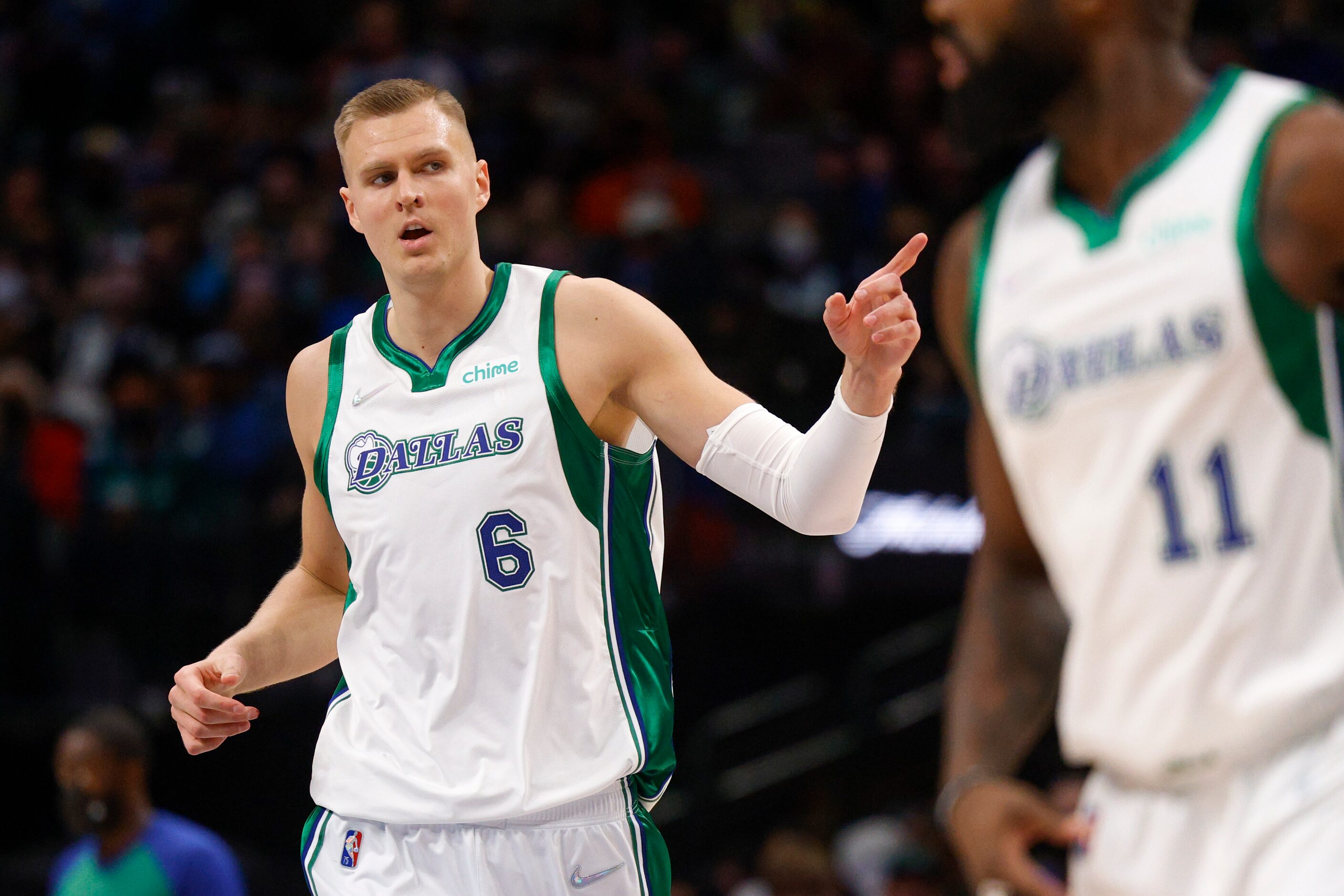 Dallas Mavericks center Kristaps Porzingis (6) celebrates a three-point shot during the...