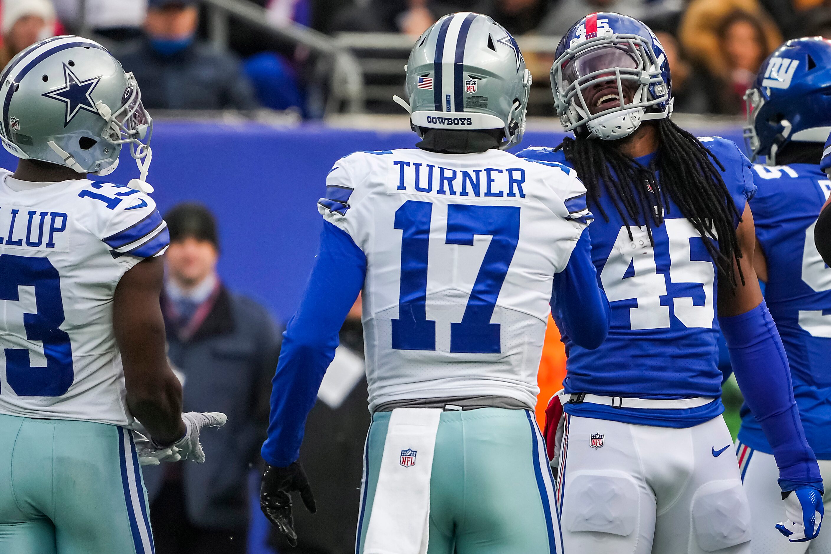 New York Giants linebacker  Jaylon Smith laughs with Dallas Cowboys wide receiver Malik...