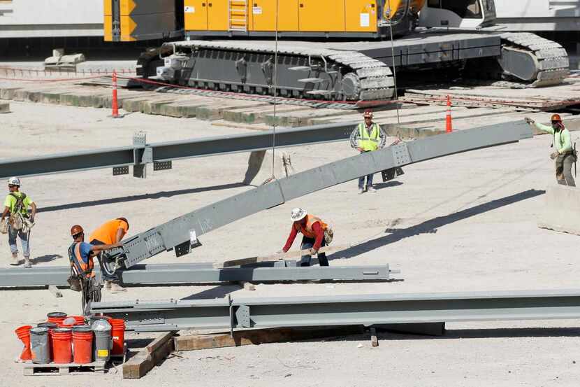 
Construction workers assembled girders at the construction site for The Star in Frisco on...