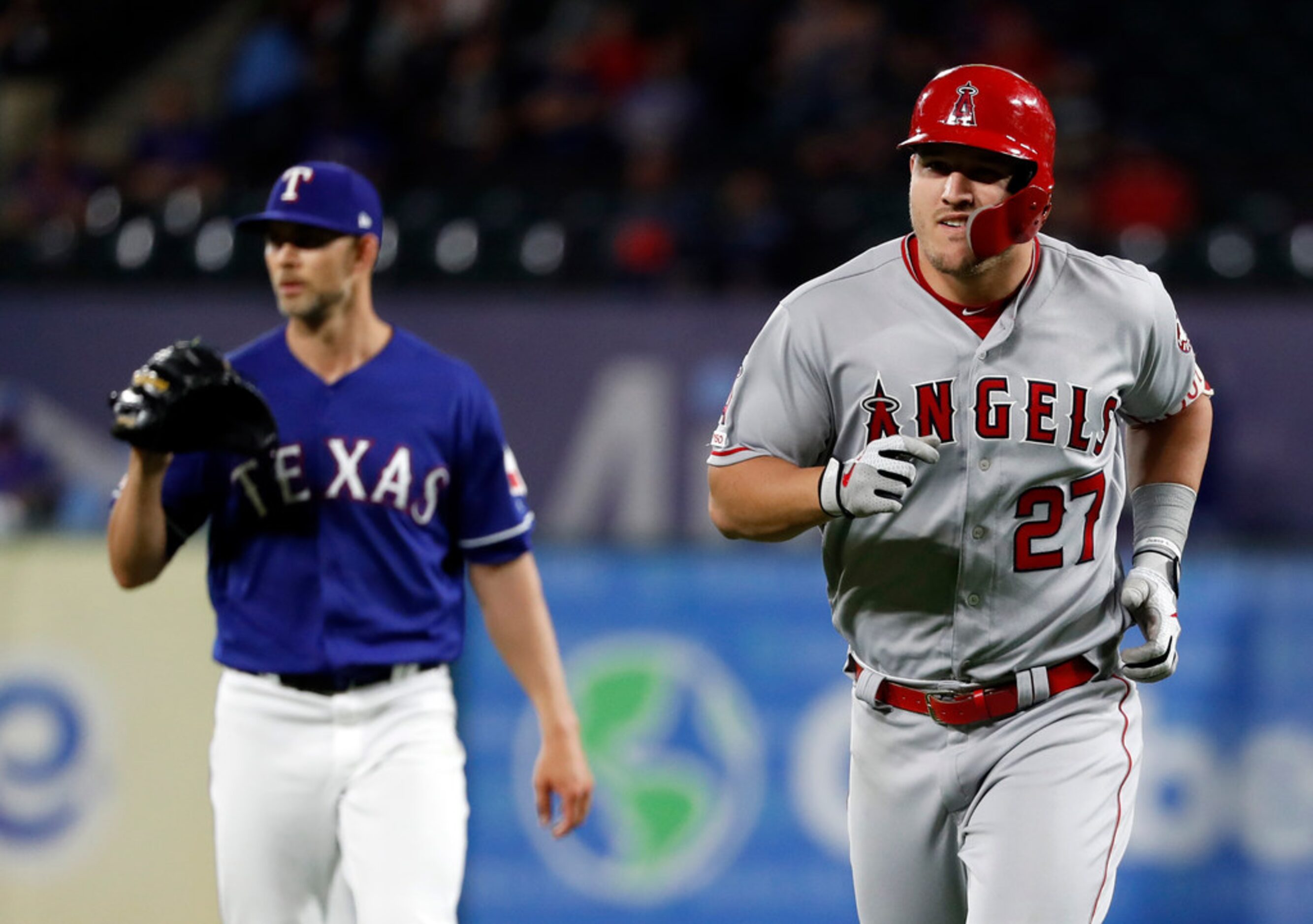 Los Angeles Angels' Mike Trout (27) jogs back to the dugout after popping out on a pitch...