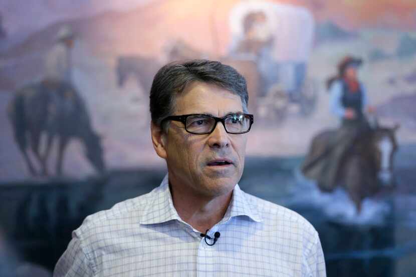  Republican presidential candidate former Texas Gov. Rick Perry speaks to the media...